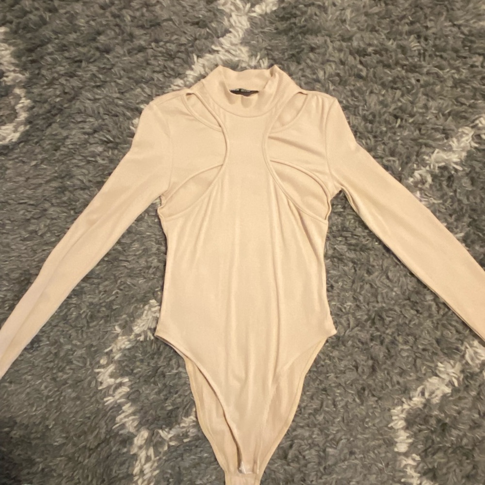 Nude cut out body suit